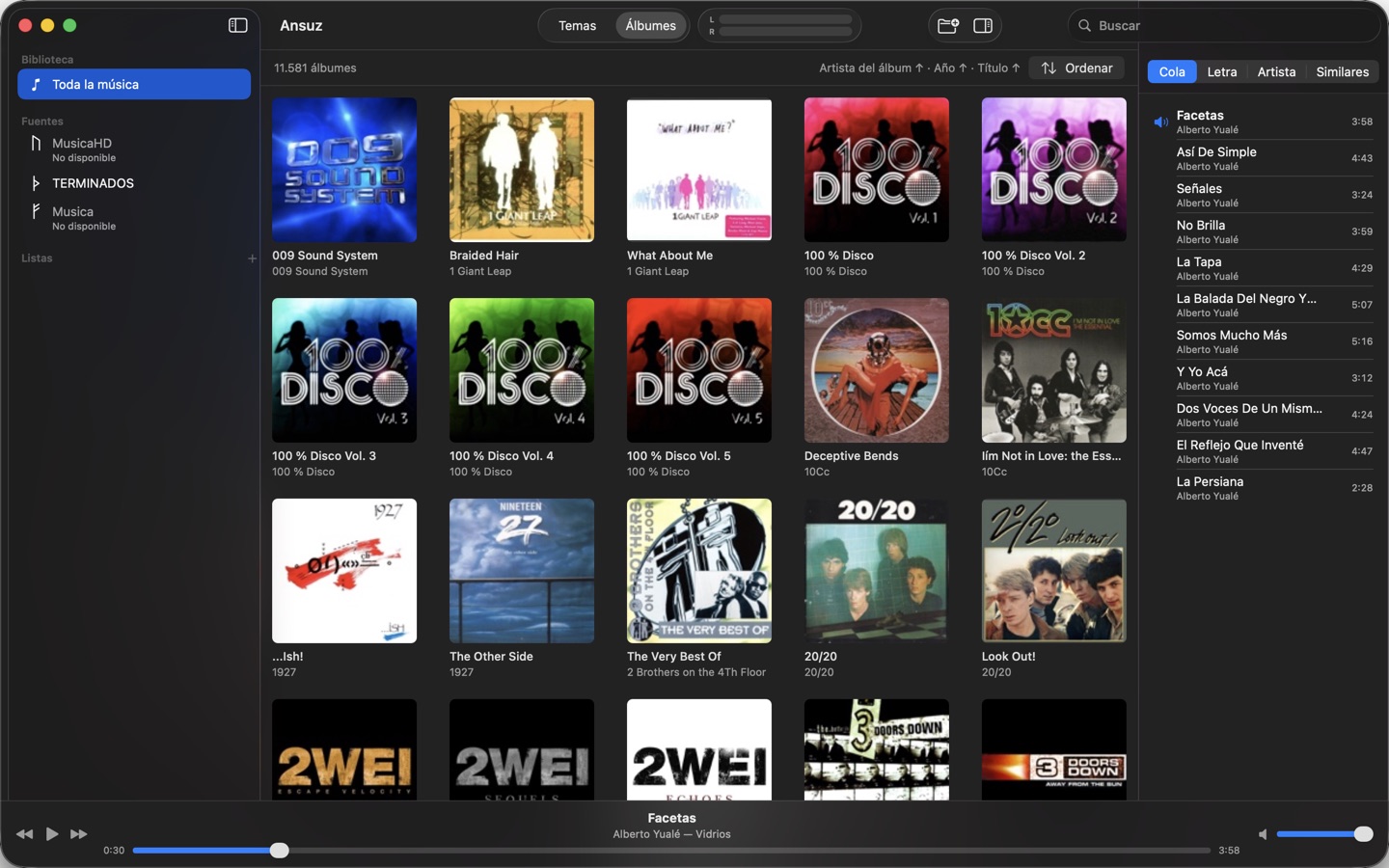 The album grid: 11,581 albums sorted by album artist, year and title.